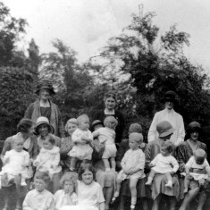 Mrs Lewis with children and nannies in The Park, Nottingham