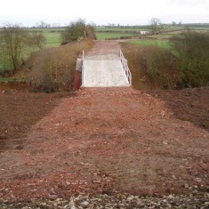 OLYMPUS DIGITAL CAMERA The regraded approach to the new '3 Arch Bridge'