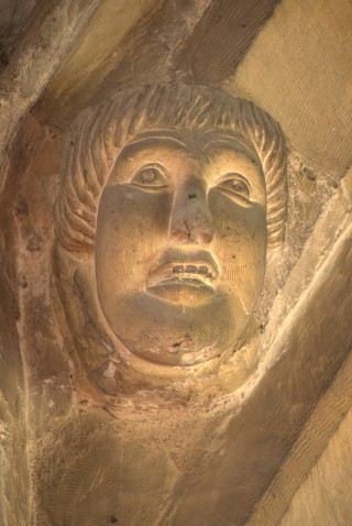 P1050461 This benign face looks down at you when you walk through the south door into the church.