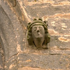 P1050506_2_S Carved face on window moulding on the south face of the tower.