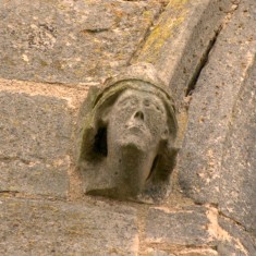 P1050510_2_S Carved face on window moulding on the south face of the tower.