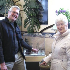 Supra Gerald and June Pedge show off Len Palmer's 1950s milk bottles