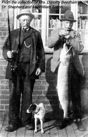 Dr. Shepherd and Mr. William Sutton, with prize pike caught in the canal.