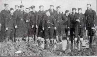207 Squadron Armourers amid the appalling conditions at Bottesford during the winter of 1941. Left to right: Smithers, F /Sgt Weatherall, Eric, Bob Waldrer, Dennis Bentley, Bill Freeman, Ron Walker, 'Ginge', 'Housie', Alf, George, Eric King, Alan and Vic | ©️Vincent Holyoak