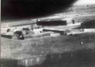 Photo2_Ch3_701LR Bottesford's camouflaged technical site, February 1942. Bordered by the hangars are the main stores, the parachute store, the workshops and the squadron and flight offices - note also the crew bus.
