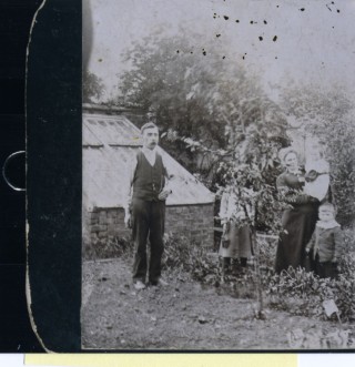 Photos055 William Samuel, Dot Samuel, Mary Ellen Samuel and Billy Samuel in the garden behind the Market Street Store