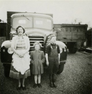 Photos063crop3 Kathleen Samuel with Catherine and John standing in front of a new lorry