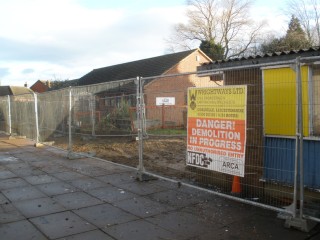 The demolition site, with the Play Group building in the background.