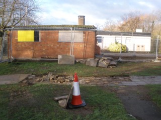 The remaining shed, with the Community Centre in the background.