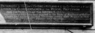 Details of J.D.Robinson's shop sign - 'Patronized by His Grace, The Duke of Rutland, K.G. The Ex-Sheriff J.P. of London, The Clergy, Gentlemen of the Medical Profession And Nobility of the District. Our celebrated Pies have been supplied to the Duke of Rutland at Belvoir Castle for Luncheons etc. and His Grace writes with Respect to their Most Excellent Flavour and Quality.