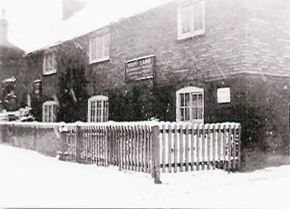 Six_Bells_Xmas The Six Bells Tea Room, early C20th. The signs read: left to right, 'Car for Hire', 'Mary Lamb, Refreshments Provided, Large & Small Parties Catered For', 'Teas Provided'.