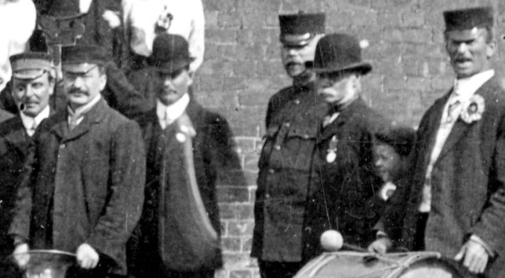 Detail of Band 1911, right to left: Joe Hollingsworth, unamed boy, William Sutton, Inspector Garten,  Sam Winn, 'Tinker' Briggs, William Pacey