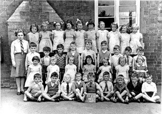 In the yard of the old school on Grantham Road.