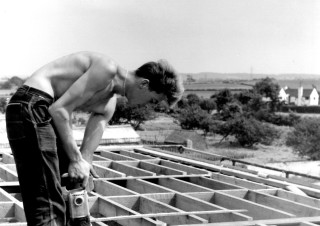 Neville Bagnall working on the building of the new schol