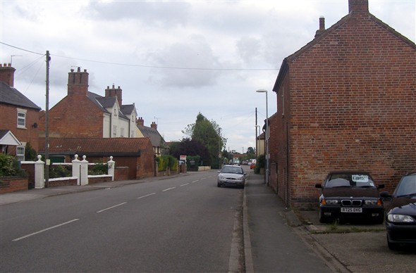 A contemporary  view of High Street from Woodhouse and Carman's garage.