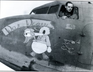 p_105 Captain Hugh J. Nevins, the 50th Troop Carrier Wing's glider officer, in the cockpit of his personal C-47 'War Weary'