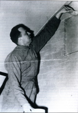 p_107 Lieutenant Joshua D. Logan of the 50th Troop Carrier Wing's A-2 Section (Intelligence), painting a room at Wing Headquarters. After the war Logan found fame as director of the film South Pacific and co-writer of the musical Paint Your Wagon