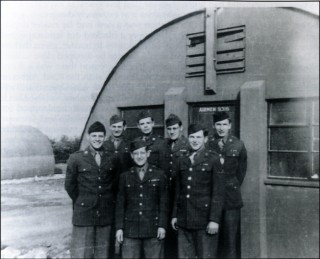 p_115 Hut companions of the Headquarters, 50th Troop Carrier Wing, Bottesford 1944. Left to right: Wally Weinkam, Raymond Seaton, Eugene Norstein, Walt F. Pettit, Clayton Hesser, Frank Ehrman and Julius Meister