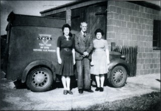 p_1211 'Char and a Wad' - the all important Y.M.C.A. tea waggon and its civilian volunteer staff outside the garage on the Old Communal Site, 1945