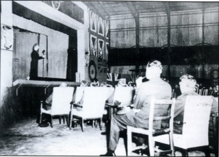 p_97 'On a wing and a prayer' - Gracie Fields gives a concert in one of Bottesford's hangars, 31st August 1943. Officers sit in chairs, 'erks' hand from the ceiling, and fourteen disgruntled crews are sent to attack Berlin!