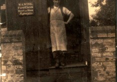 W.A. Wing, cobbler, at his workshop hut