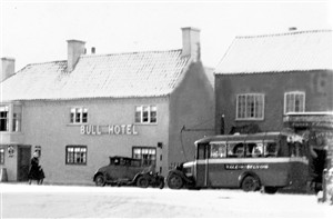 Randall's bus by the Bull Inn, Bottesford, a snowy winter's day | Judi Broadhurst