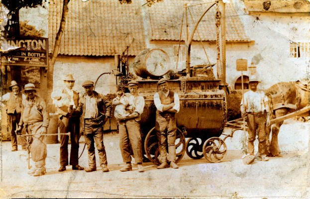 Road men outside the Red Lion, a team of road menders with their tarring machinery | Mrs Maureen Hill
