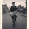 Arthur Wing, postman, on bike, Queen St
