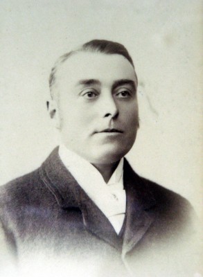 A close-up studio portrait of Mr Frank Norris | Mr Gerald Norris