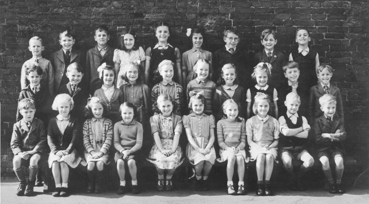 Children at the village school, posed together in the school yard, 1950s. | Neville Spick