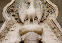 The peacock crest above shield of the 2nd Earl of Rutland