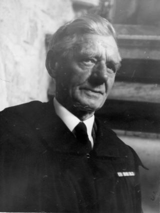 Verger Tommy Robinson, wearing his robes and ribbons. | Bottesford Heritage Archive, from the collection of Mrs Ada Bond.