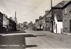 Postcard of Queen Street, looking northwards, old Coop on left.