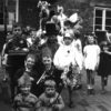 Children prepare for May Day celebrations, 1953 Coronation Year.