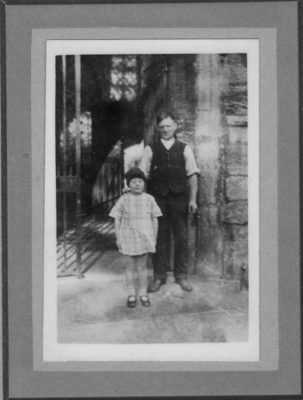 Tommy Robinson and child at the church porch.