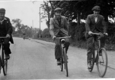Three men cycling to or from work, Belvoir Road
