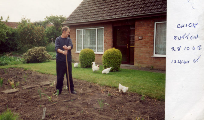 BOT169_032_PSU_02 Chip with his chickens at No.13, High Street
