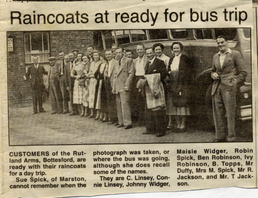 BOT169_053_PSU_02 Raincoats at Ready for Bus Trip