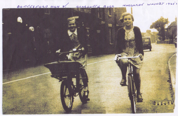 Cycling through Bottesford in the 1940s, Charlotte Bugg and Margaret Waudby, | From the collection of Philip Sutton