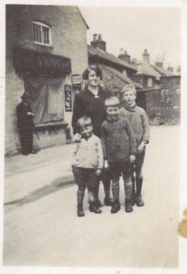 By Winn's store, c.1933. Evelyn Marston with her boys: John, Frank and Vic (oldest). | The Marston family