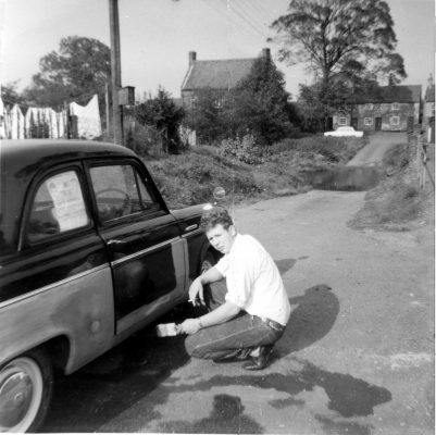 BOT119_004 AHE0004 Man painting a car, by Devon Lane, Bottesford