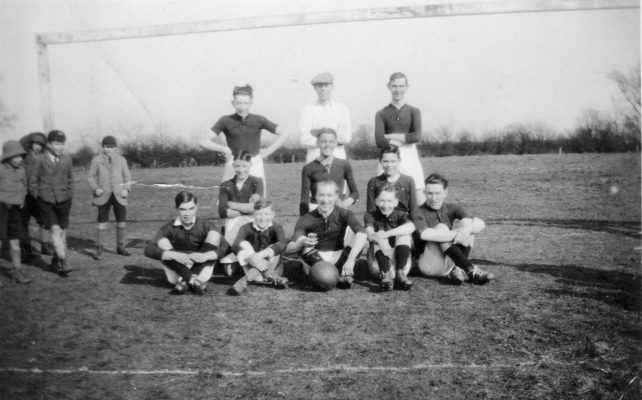 BOT119_015 Ann Hewitt_0002_02 Bottesford football team, and a group of admiring schoolboys. | Mrs Anne Hewitt, Bottesford Local History Archive