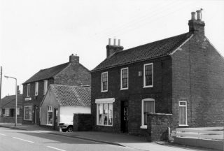1970s view of the Post Office and Eric George's butchery (the single-storey building to the left). | Bottesford Local History Archive