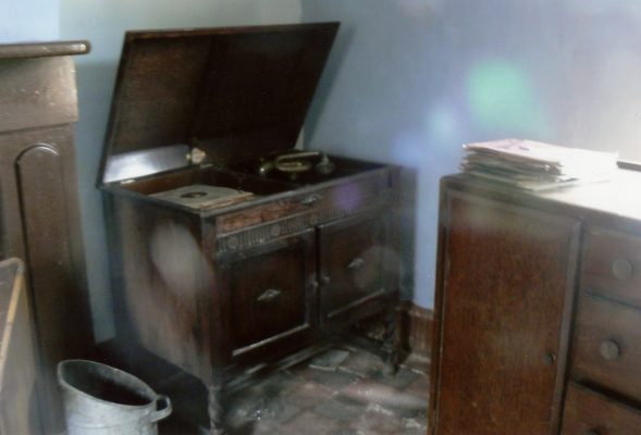 Probably a corner in the living room, an old gramophone and collection of 78s. | Margaret Langton