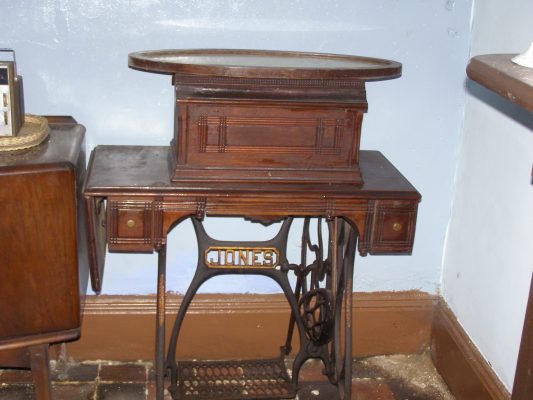 The 'spare' sewing machine (with a mirror lying on top). | Neil Fortey