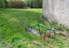 An old plough, on the grass by the Lock House