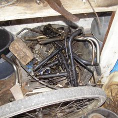 Bicycle wheels and frame tubes, in one of the sheds. BOT196/090 | Neil Fortey