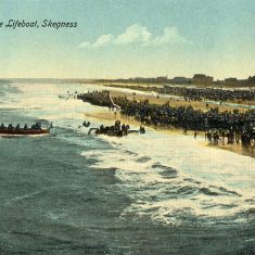 A pre-WW1 view of the beach at Skegness, the oarsmen of the life-boat pulling hard as she heads out into the sea. | From Janet Dammes' family archive.