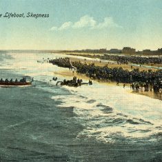 BOT173_010 Marston album3 17 A pre-WW1 view of the beach at Skegness, the oarsmen of the life-boat pulling hard as she heads out into the sea. | From Janet Dammes' family archive.