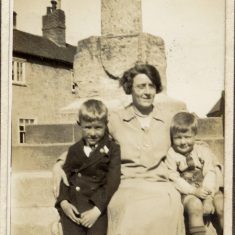 BOT177_004 Marston album1 04 #1 On the steps of Bottesford market cross, Evelyn Marston with sons Vic on her right, and Frank on her left. Mid-1920s. | Janet Dammes
